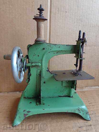 A small sewing machine, a toy tin toy with price 95.00 BGN | € 48.57 A small sewing machine, a toy tin toy with price 95.00 BGN | € 48.57