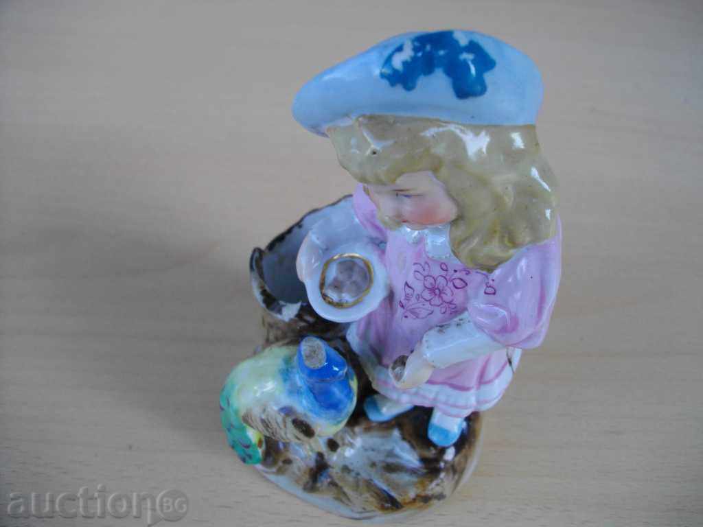 Auction Statuette "Child eating peacock" porcelain old for match Auction Statuette "Child eating peacock" porcelain old for match