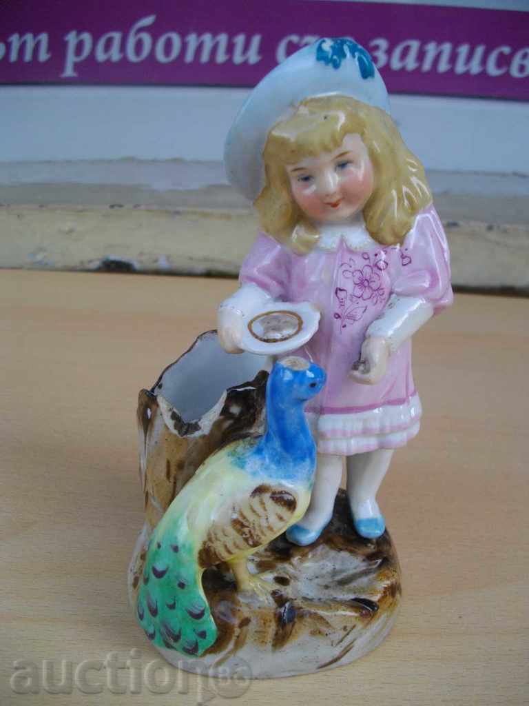 Statuette "Child eating peacock" porcelain old for match