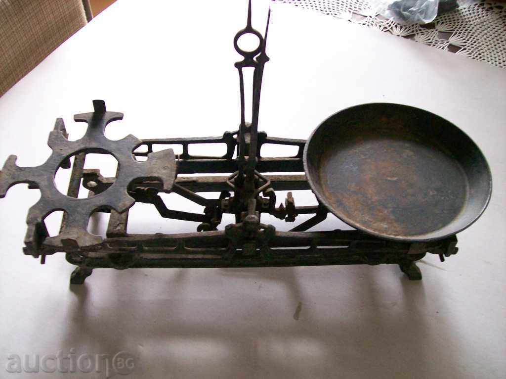 Very old commercial scale (balance scale) Very old commercial scale (balance scale)