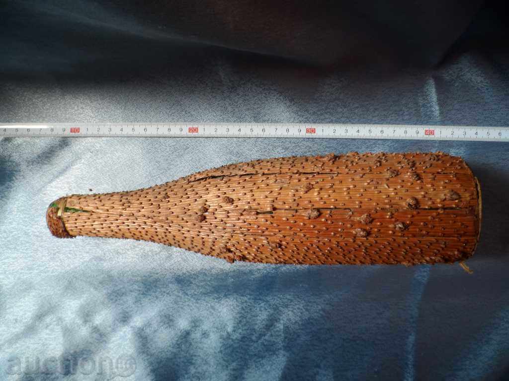 an old glass bottle decorated with the bark of a coniferous tree with price 10.00 BGN | € 5.11 an old glass bottle decorated with the bark of a coniferous tree with price 10.00 BGN | € 5.11