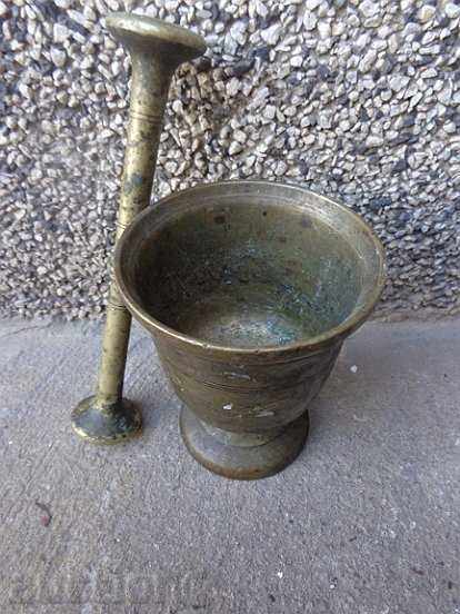 Old bronze mortar, hammer with hammer
