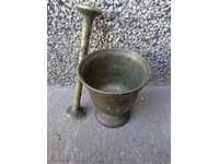 Old bronze mortar, hammer with hammer