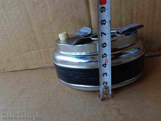 Delivery of Old ashtray with button, cigarette, fascia Delivery of Old ashtray with button, cigarette, fascia