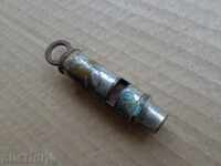 An old metal whistle