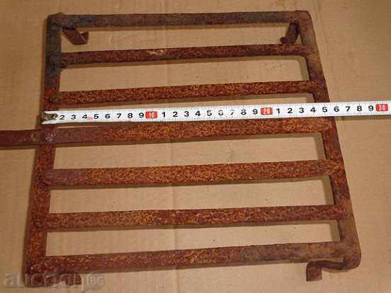 Delivery of An old metal grill, wrought iron, a barbecue Delivery of An old metal grill, wrought iron, a barbecue