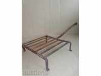 An old metal grill, wrought iron, a barbecue