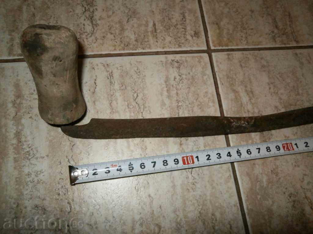Delivery of Old rusty wrought iron tool