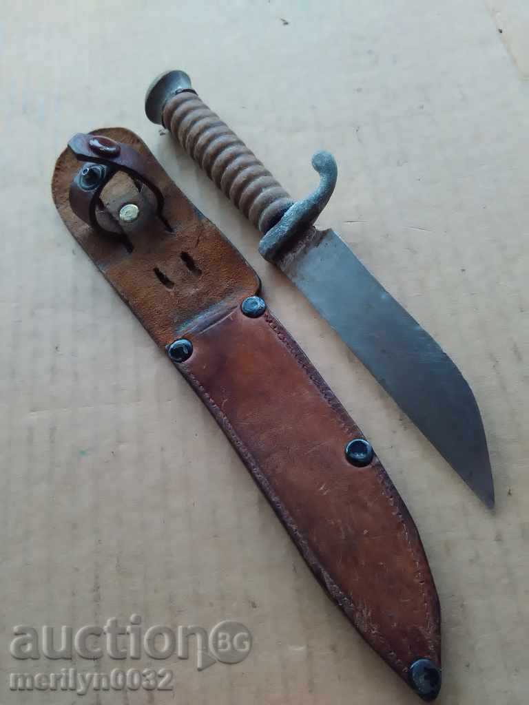 An old knife with a guard and a cane of a warrior named Hitler