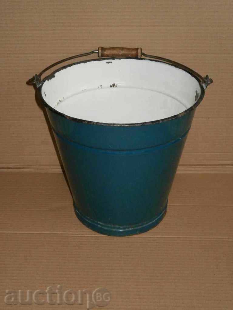 a larger, old enameled bucket