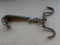 Old forged hook with roller, crane, anchor