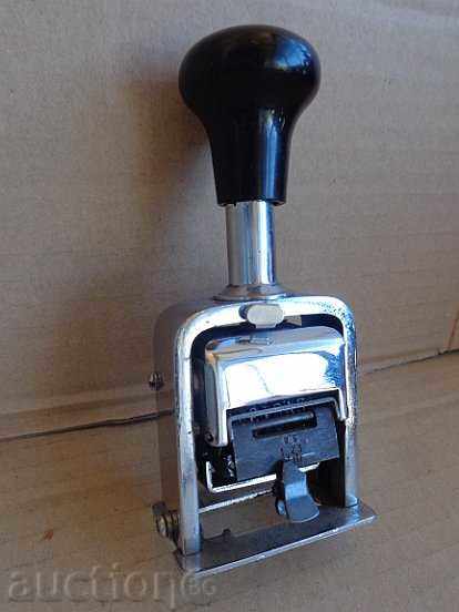 Old rotating stamp with bakelite handle