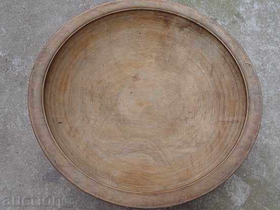 A large bowl of wood, a round bowl, a wooden, primitive tray