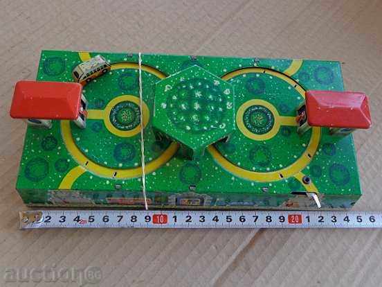 Delivery of Children's tin toy game winding with a key works