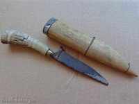 An old knife with a cane and a horn handle, engravings, a blade
