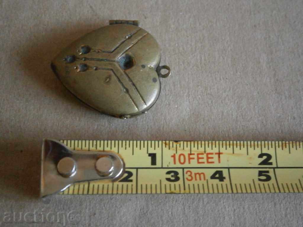 an ancient bronze heart medallion with price 41.00 BGN | € 20.96 an ancient bronze heart medallion with price 41.00 BGN | € 20.96