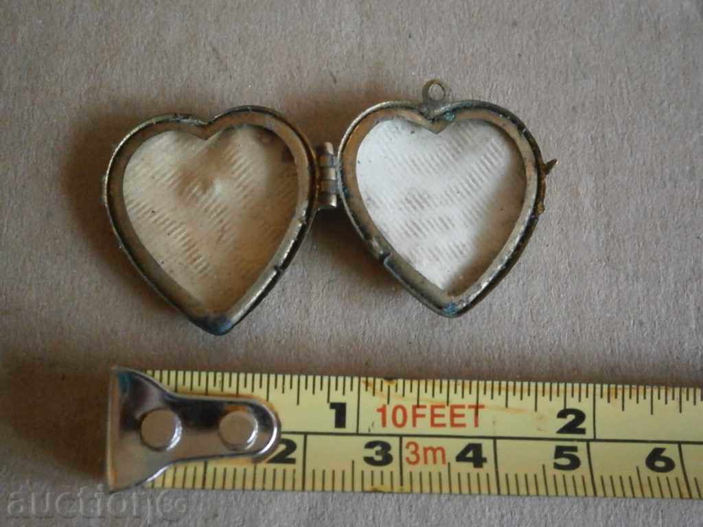 Delivery of an ancient bronze heart medallion Delivery of an ancient bronze heart medallion