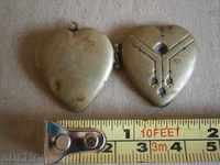 an ancient bronze heart medallion