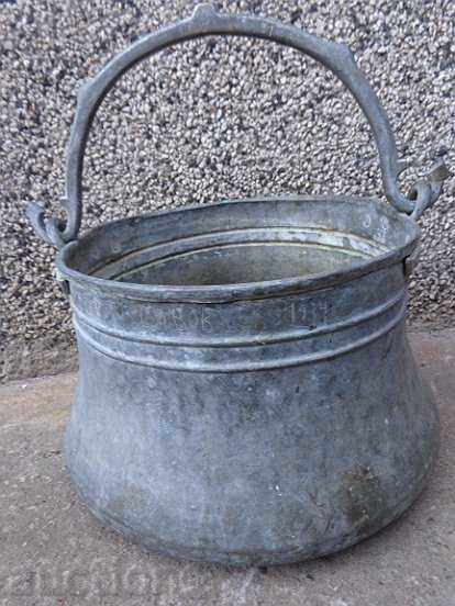 Tinned cauldron, old coin with inscription, copper vessel, coin
