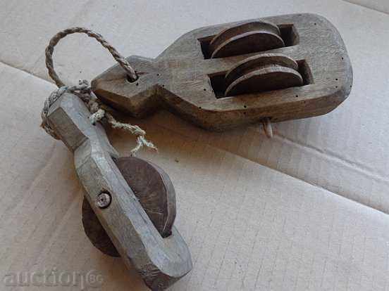 Old wood pulleys, polispast for loom, wooden, primitive Old wood pulleys, polispast for loom, wooden, primitive