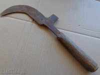 Old instrument picker with engraved wrought iron blade