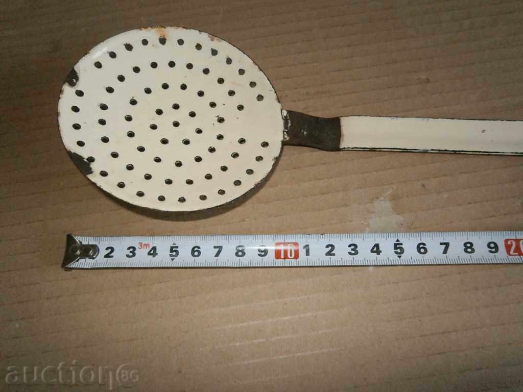 Delivery of An old enamel spoon Delivery of An old enamel spoon