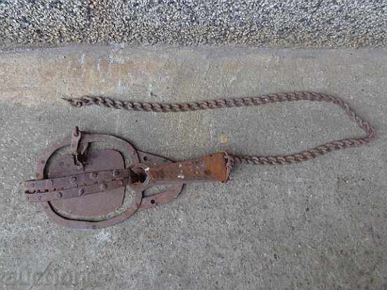 Hand forged trap with wrought iron chain syntax