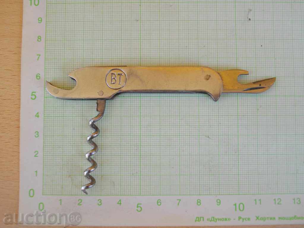 Auction "VT" opener with a corkscrew from a sucker Auction "VT" opener with a corkscrew from a sucker