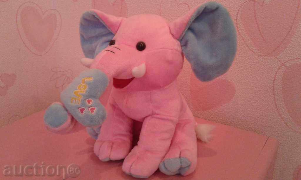 a plush elephant with a heart