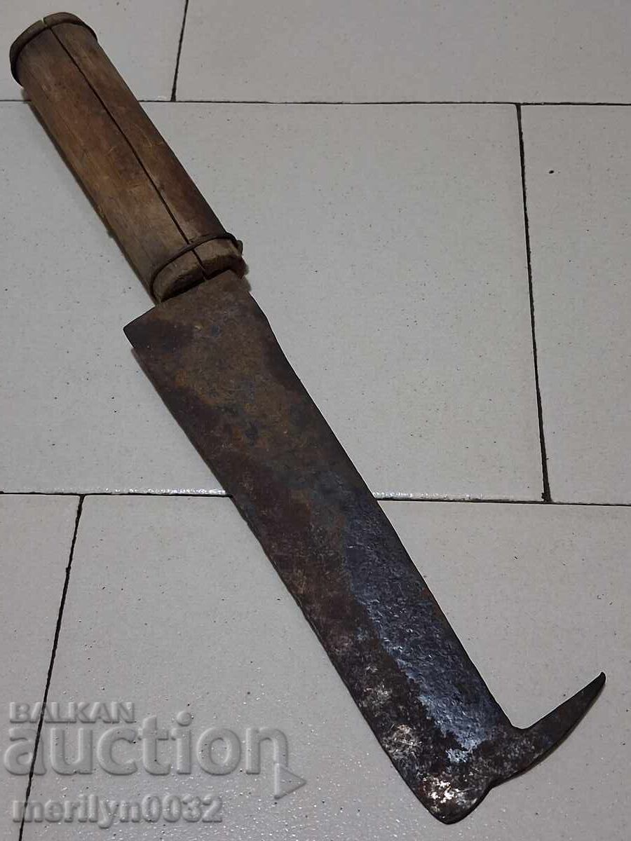 Hand forged saber, blade, knife, top with white bluish chin Hand forged saber, blade, knife, top with white bluish chin