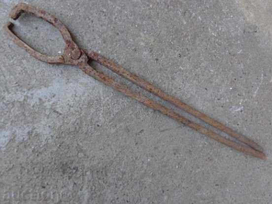 Delivery of Old forging pliers, wrought iron, tool