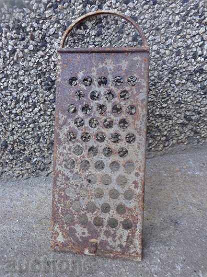 Old grater from the beginning of the twentieth century, primitive