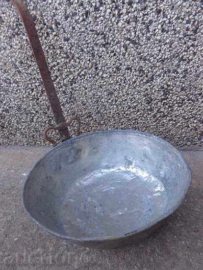 A copper pan, a copper pot, a baker
