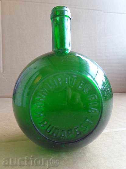 An old bottle of branded cognac glass bottle inscription