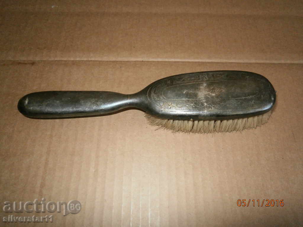 an old silver brush