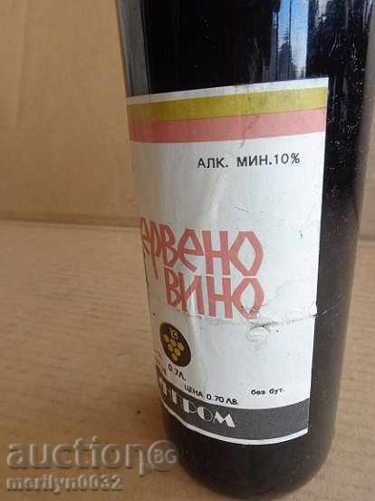 Auction  A bottle of red wine harvested by a juvenile UNPAIDED elixir