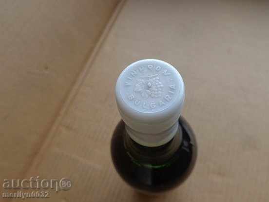 Delivery of A bottle of red wine harvested by a juvenile UNPAIDED elixir