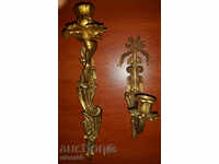 Antique wall bronze candlesticks with unique ornaments.
