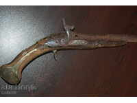 Pistol cu cremene capsulă