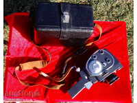 Cinema camera, leather suitcase, lenses, film.