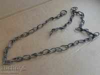 Old forged chain with ring made of bronze hand-knit chain