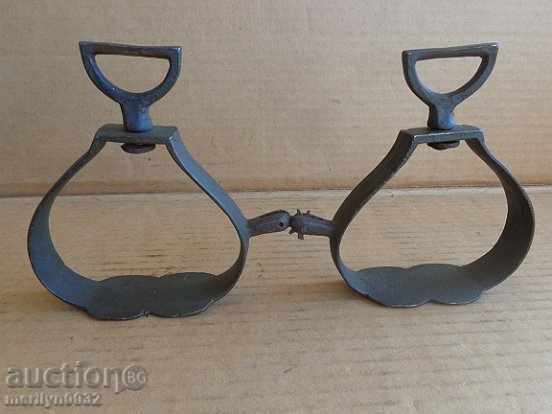 Old bronze stirrups with spurs, cavalry, saddle Old bronze stirrups with spurs, cavalry, saddle