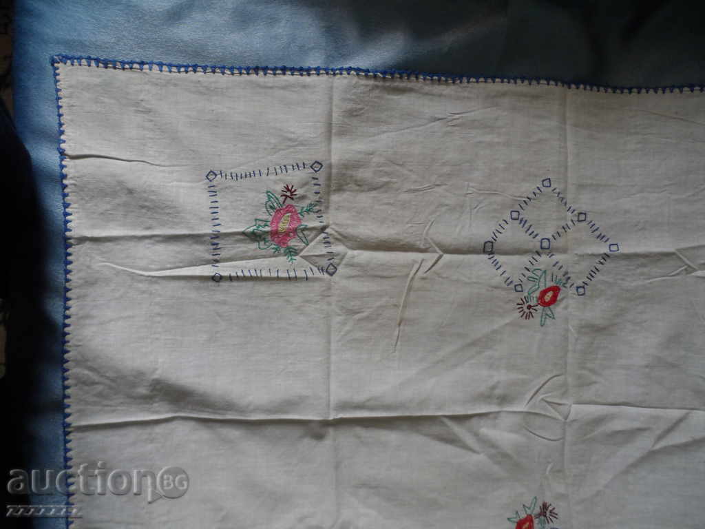 Delivery of old embroidered tablecloth