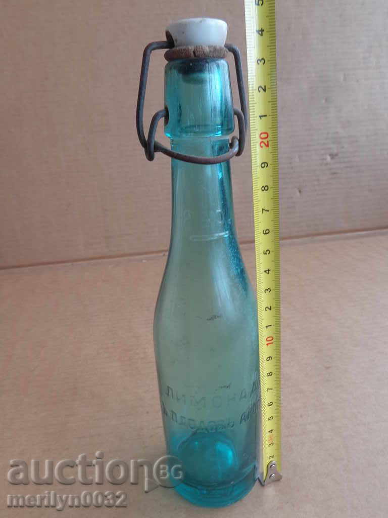 Auction  A bottle with a cork, a bottle of lemonade from the city of Elena