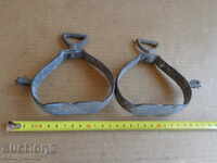 Old bronze stirrups with spurs, cavalry, saddle