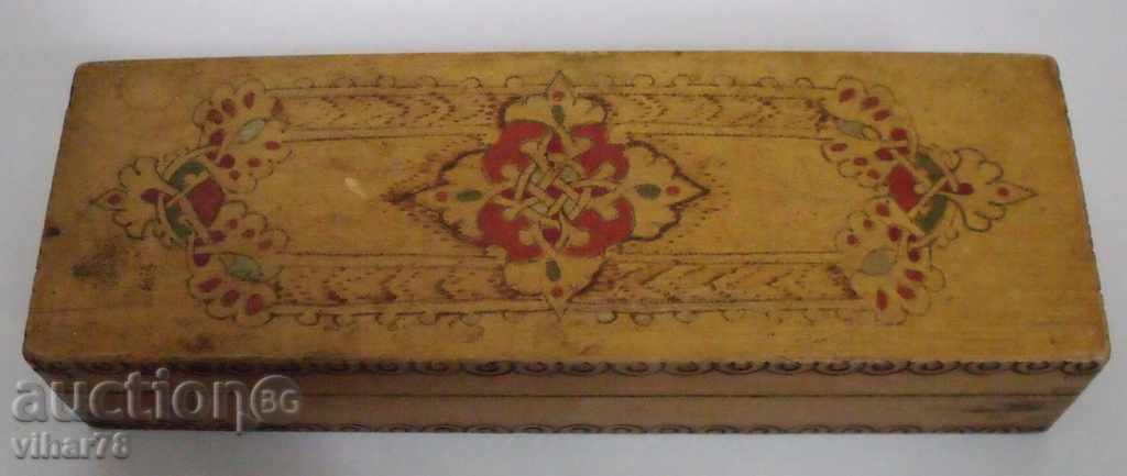 An old wooden pencil box