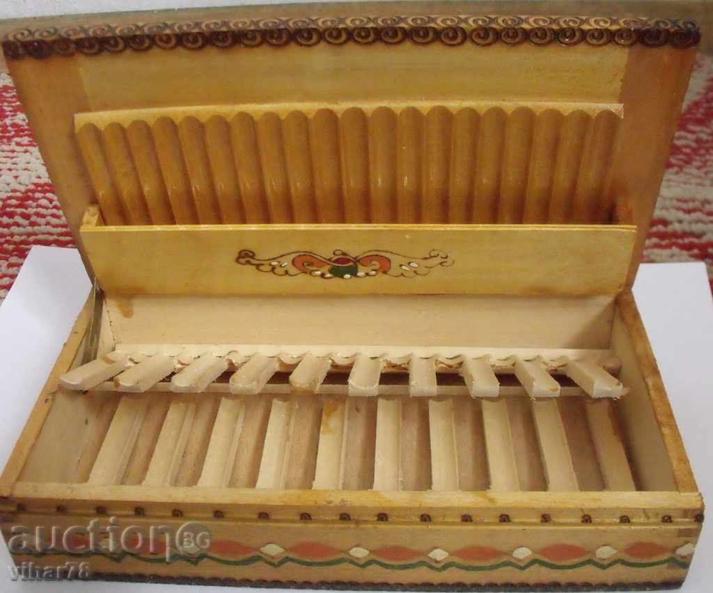 An old wooden cigarette case