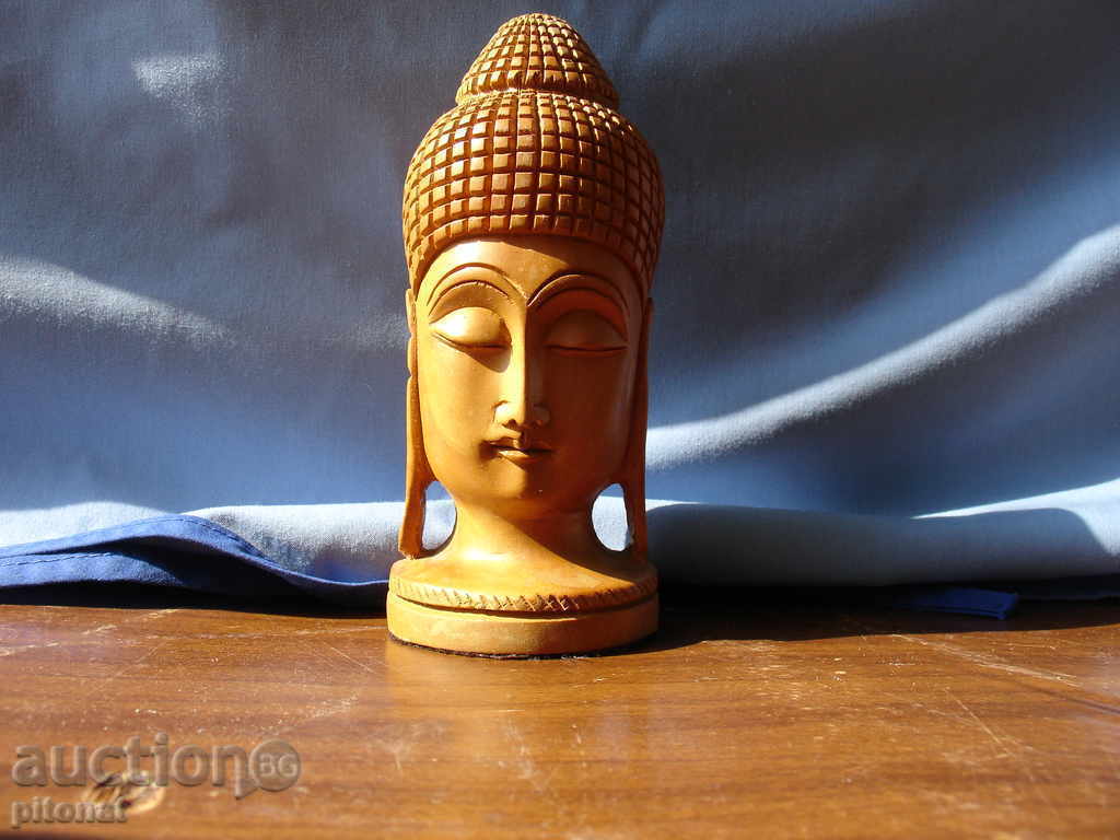 Collecting wooden statuette head