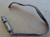 An old police whistle for about 100 years with a strap