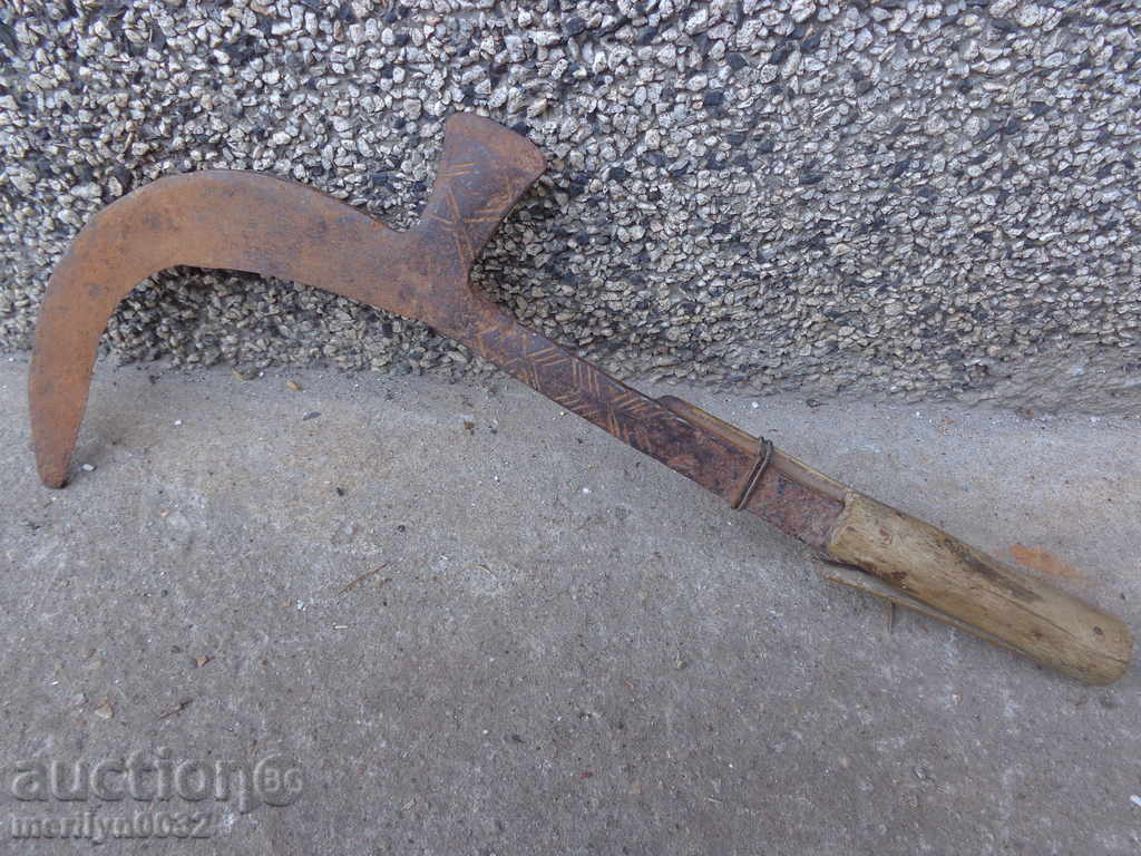 Old manual forged cutter with engravings, wrought iron toothbrush blade
